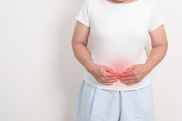 Elderly woman having Colon pain for Colonic disease, Inflammatory Bowel, IBD, Colorectal cancer, Ulcerative colitis, Diverticulitis, Irritable bowel syndrome, Digestive system and Health concept