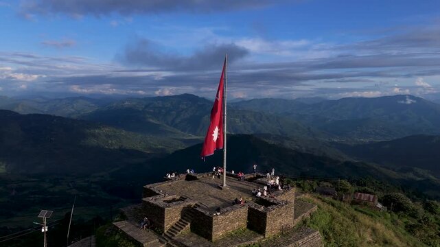 Himalayan mountain peak success concept with waving Nepal national flag, high-altitude trekking adventure 4k RAW