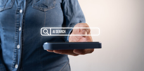 A woman holding a phone with an artificial intelligence search bar