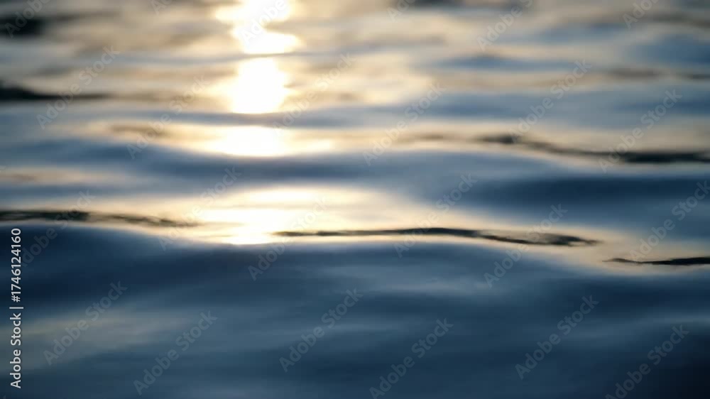 Wall mural a close-up, shallow depth of field shot focuses on the abstract patterns of sunlight dancing on the 