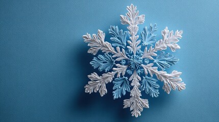 Minimal Snowflake on Bright Blue Background. Flat Lay Season Concept.