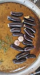 Eggplant and zucchini are fried with garlic and herbs in oil