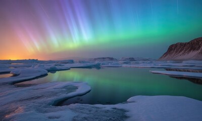 Vibrant aurora borealis over a frozen landscape with reflecting water & distant mountains
