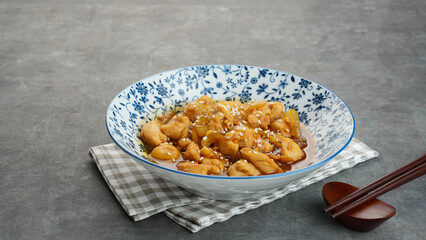 Teriyaki Chicken with onion, soy sauce, butter and sesame seeds