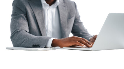 a person in a suit sits using laptop isolated on white background