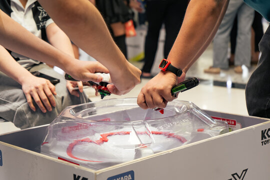 Bangkok, Thailand - September 13, 2025 : People playing Beyblade X, a battling spinning top, in a weekly competition event at a shopping mall.