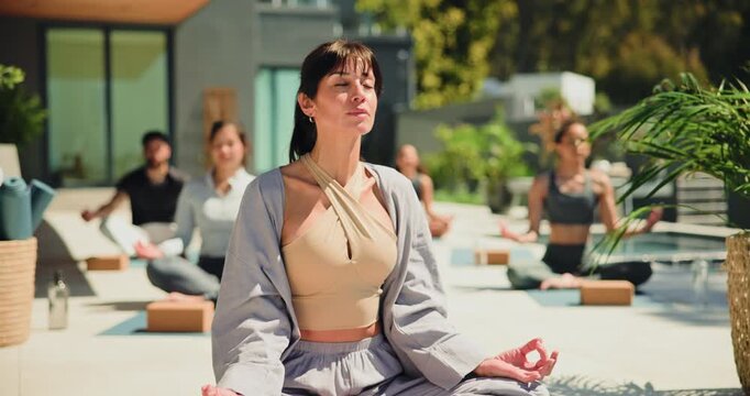 Meditation, breathing and prayer hands with woman in class for spiritual retreat, namaste and balance. Zen exercise, holistic healing and yoga with people for mindfulness, peace and self care mindset