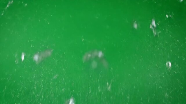 Dynamic explosion of a glass pane shattering outwards on green screen background dynamic, film, studio shot