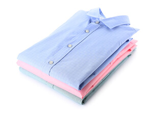 Stack of stylish folded collar shirts isolated on white background