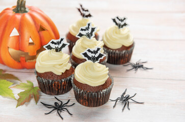 Halloween cupcakes decorating with bats, pumpkin, and spiders
