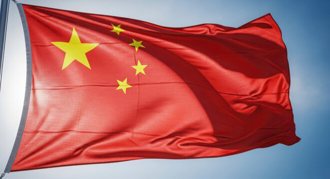 The National Flag of the People's Republic of China Waving Proudly Against a Clear Blue Sky