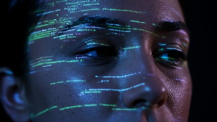 Young woman with code projected on her face in dark environment  