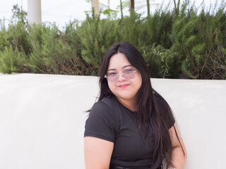 Confident Asian woman with real body smiles while enjoying casual day out. Body positive concept.