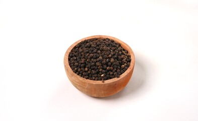 Aromatic Spice: Black Peppercorns in Wooden Bowl