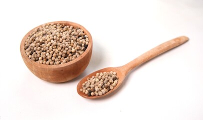 Mustard Seeds: Culinary Spice in Wooden Bowl and Spoon on White