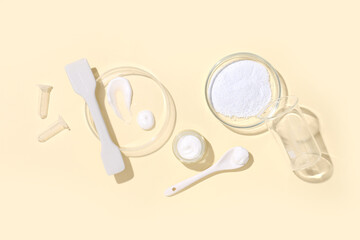 Petri dishes with different samples and laboratory equipment on beige background