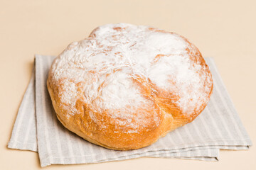 Assortment of freshly baked bread with napkin on rustic table top view. Healthy unleavened bread. French bread