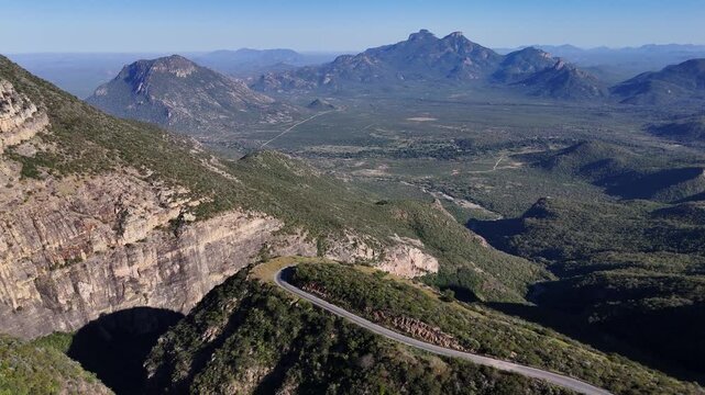 Scenic aerial footage of the serpentine mountain road at Leba Pass, Angola, curving through steep terrain and breathtaking African highlands