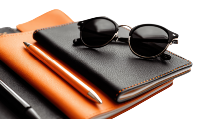 Travel essentials  notebooks, pen, sunglasses