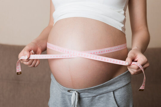 Health well being pregnancy lifestyle. Pregnant woman measuring her belly. Healthy pregnancy. Health well being pregnancy lifestyle