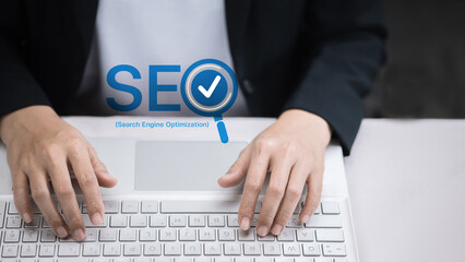 Hands Typing on Keyboard with SEO Logo and Check Mark for Search Optimization