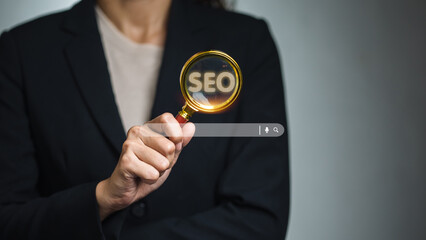 Business Professional Holding Magnifying Glass with SEO Text and Search Bar