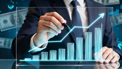 Businessman drawing growth chart