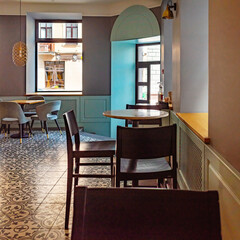Interior of a cafe with chairs and tables.