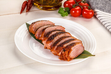 Sliced duck breast baked with cherry