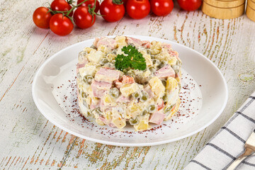 Russian traditional Olivier salad with sausages