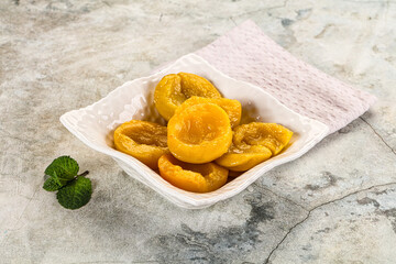 Canned marinated peach in syrop