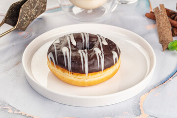 Delicous sweet donut with chocolate glaze