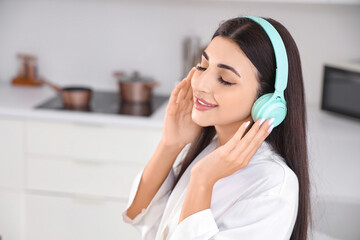 Naklejka premium Mental health and wellness, young woman relaxing with music at home