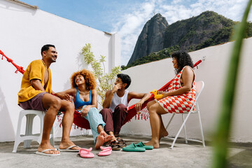 Group of friends enjoying a rooftop gathering in Rio de Janeiro
