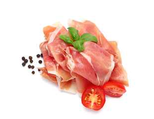 Delicious prosciutto slices with basil leaves, peppercorns and cherry tomato on white background
