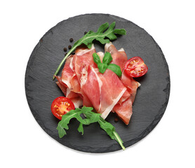 Black board with delicious prosciutto slices, arugula leaves, peppercorns and cherry tomato on white background