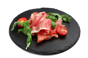 Black board with delicious prosciutto slices, arugula leaves, peppercorns and cherry tomato on white background