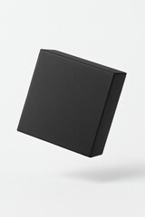 Minimal floating black rectangular cardboard box isolated on clean background, elegant packaging mockup for luxury product, watch, jewelry, or gift branding, neutral lighting, high quality, modern