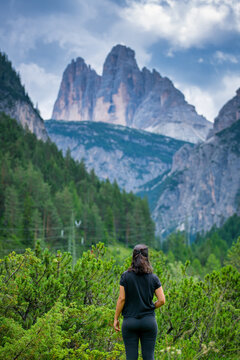 Woman hiking enjoying Tre Cime di Lavaredo mountain view