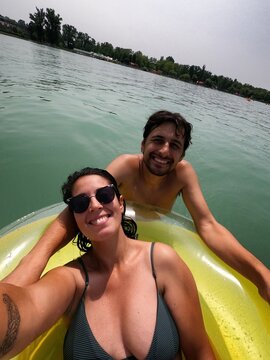 Young couple enjoying summer vacation smiling for a selfie