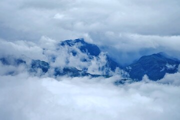The distinctive natural scenery in Y Ty commune, Lao Cai province, Vietnam in winter. Majestic high mountain ranges surrounded by white clouds.