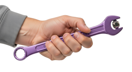 Isolated person holds purple wrench tightening a nut; repair work, construction, home maintenance