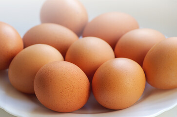Brown chicken eggs close up. Organic protein of natural origin. Rustic natural products.