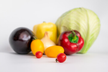 fresh vegetables. tomatoes, bell peppers, onions on a white background
