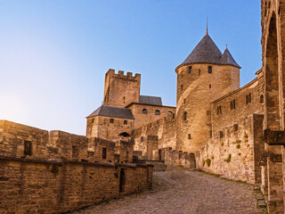 Stone towers and ramparts of Carcassonne citadel at sunday.