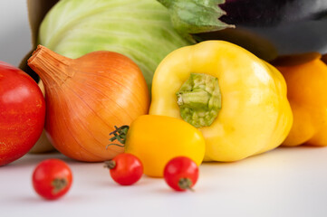 fresh vegetables. tomatoes, bell peppers, onions on a white background