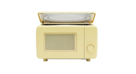 Isolated yellow vintage style microwave open with glass turntable and controls on a plain space