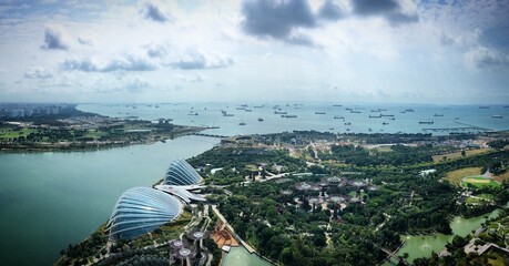 High angle view of the Gardens by the Bay, Flower Dome, Cloud Forest, Marina Bay and ships in Singapore, February 2019
