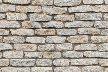 Obraz premium Rough Stone Wall Texture with Irregularly Shaped Blocks rock background isolated on a transparent background