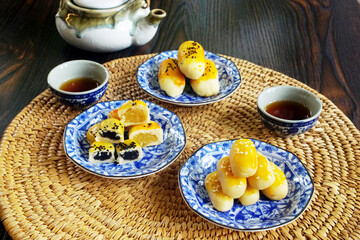 Group of fresh milk mooncakes (Chinese pastry dessert) with tea